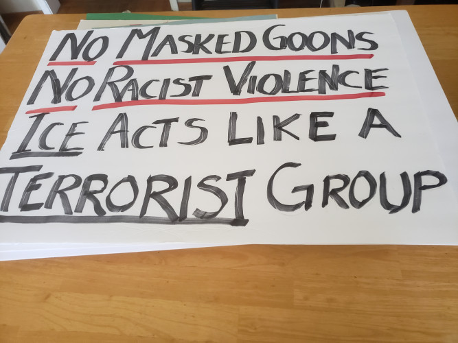 Sign that says No Masked Goons, No Racist Violence, ICE acts like a Terrorist Group