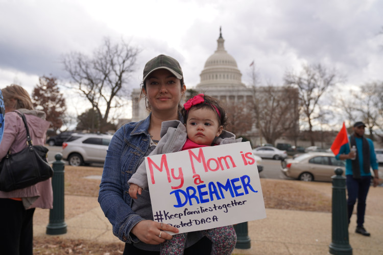 A Dreamer and her American born child at a protest in Washington DC.