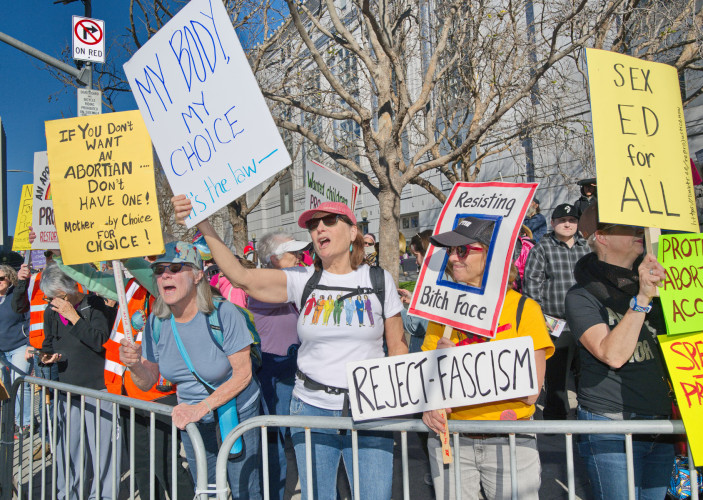 Event peaceful except for small shoving incident as police keep groups apart