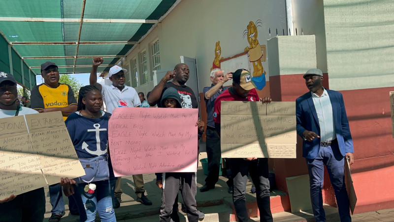 sm_namibian_workers_at_tribunal_with_placards_10-28-23.jpg