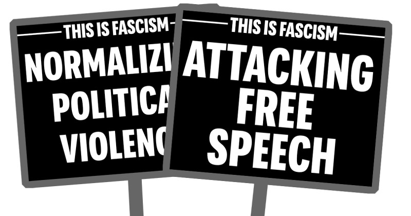 two protest signs, one says "This is Fascism: Normalizing Political Violence" and "This is Fascism: Attacking Free Speech"