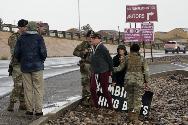 Military police arresting a protester
