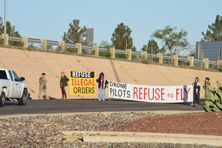 Protesters blocking the main entrance to Holloman AFB