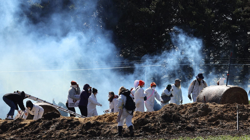 Protesters and tear gas outside Ridglan Farms fence