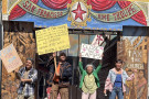 Four actors perform WRECKAGE on the San Francisco Mime Troupe's painted outdoor stage at Live Oak Park in Berkeley.