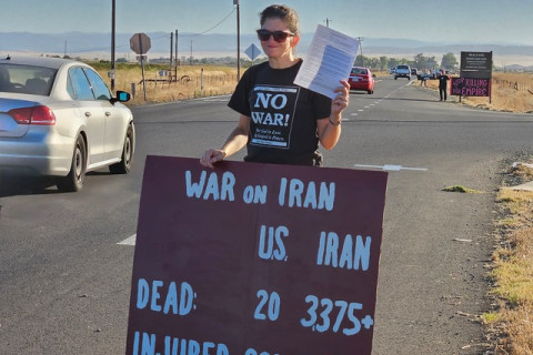 Anti-war protester holding sign