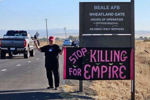 Anti-war protester holding sign