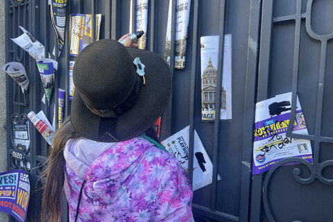 Resident Putting Up Chris Larsen's Propaganda Back On His Door