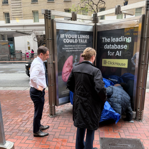 sm_lurie_harassing_homeless_with_tech_sign.jpg