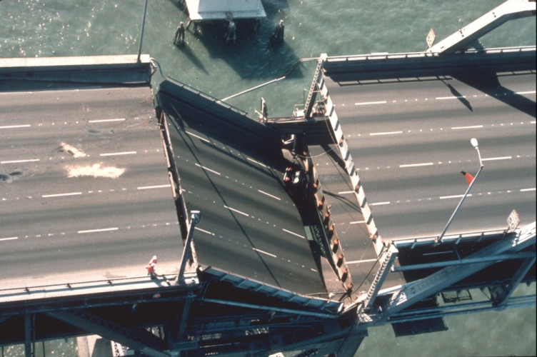 The partially collapsed Bay Bridge between Oakland and San Francisco from the 1989 Loma Prieta earthquake was repaired with help (money) ...