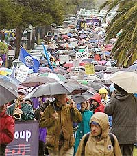 Thousands demonstrate against militarism and war despite torrential rains