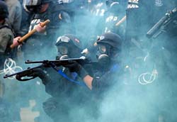 Miami riot police fire on protesters outside a Free Trade Area of the Americas meeting. Authorities