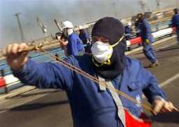 Spanish shipyard workers block railways and clash with police in Seville