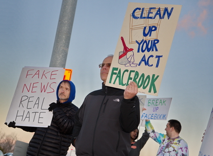 Protesters Hijack Giant "Like" Sign at Facebook Headquarters